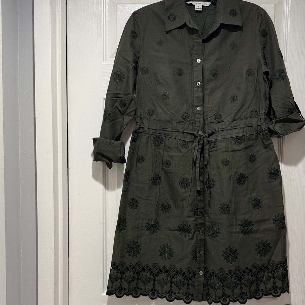 Diane von Furstenberg in a dark green cotton knit with floral eyelet lace trim.